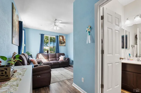 a living room with furniture and a window