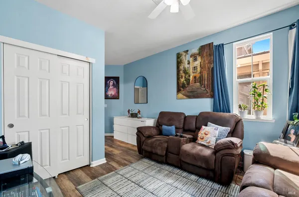 a living room with furniture and a window