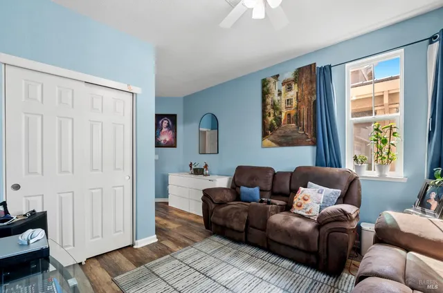 a living room with furniture and a window