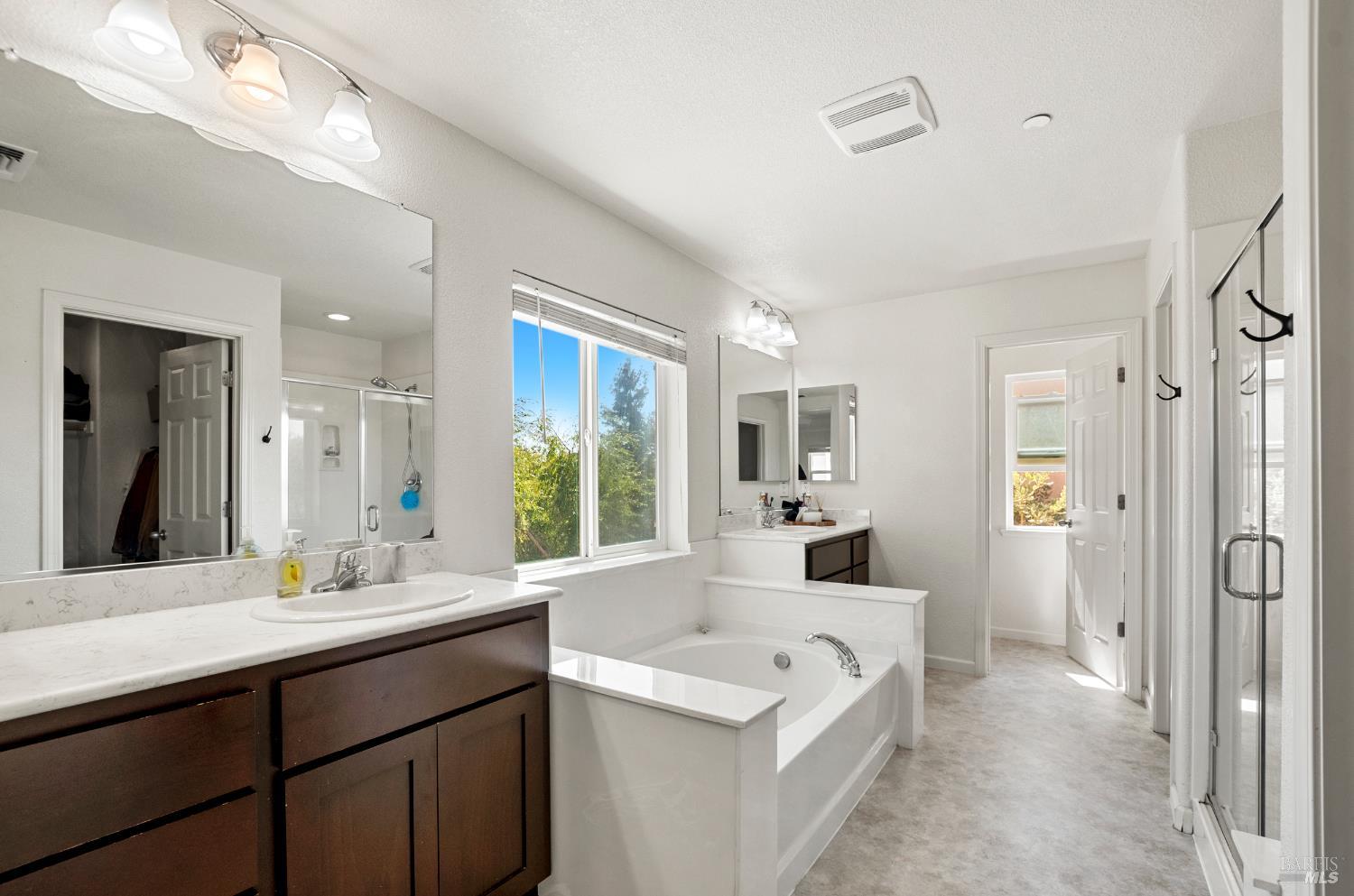 5311 Gramercy Circle Fairfield, CA 94533 - Photo 26 of 43 a bathroom with a tub sink and mirror