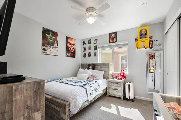 a bedroom with a bed and a chandelier