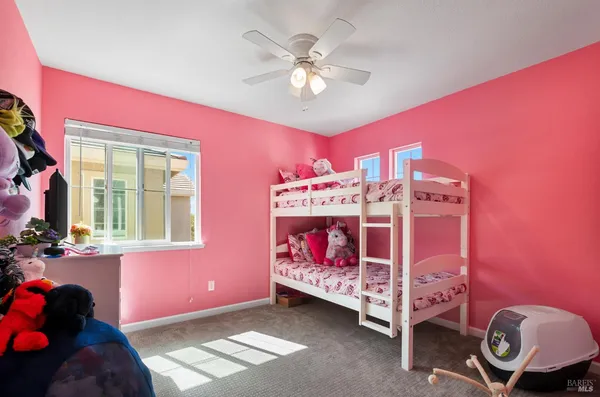 a bed room with a bed and a window