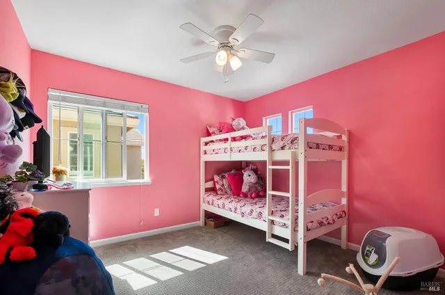 a bed room with a bed and a window