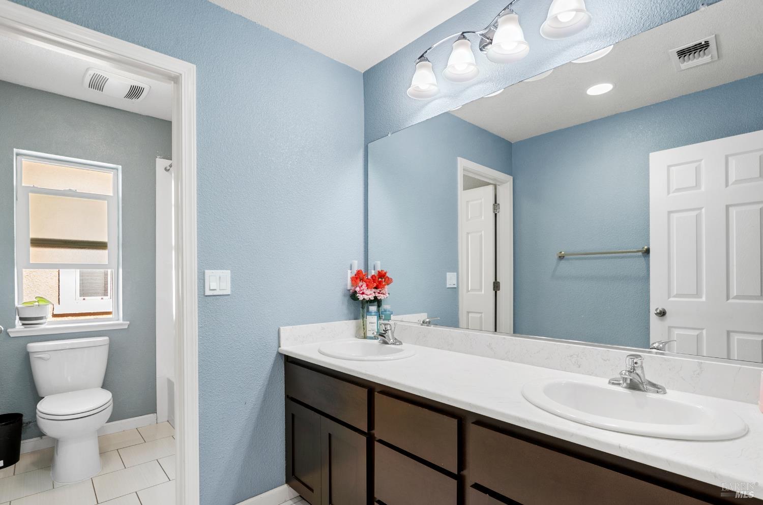 5311 Gramercy Circle Fairfield, CA 94533 - Photo 36 of 43 a bathroom with a sink double vanity and a mirror