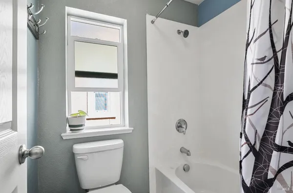 a bathroom with a toilet a sink and a bathtub