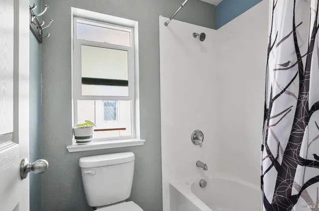 a bathroom with a toilet a sink and a bathtub