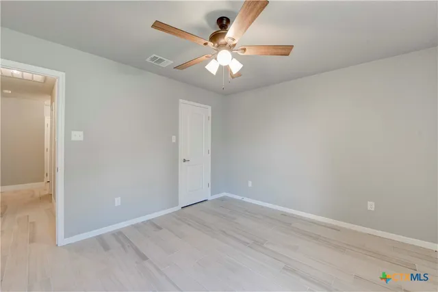a bathroom with a granite countertop sink a shower and a mirror
