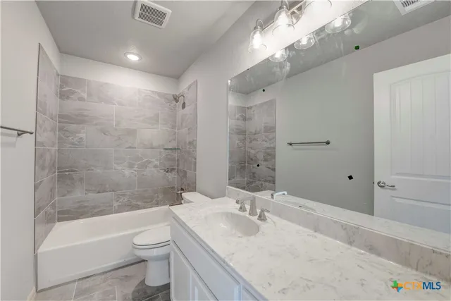 a bathroom with a sink and a toilet