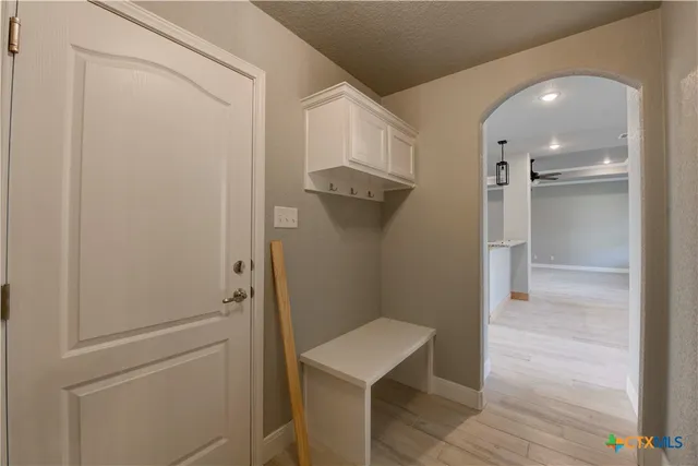 a kitchen with granite countertop a stove and a refrigerator