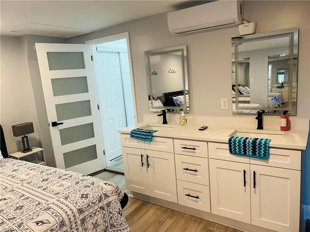 a bedroom with a bed and a cabinets
