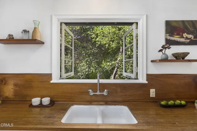 a bathroom with a sink and a window