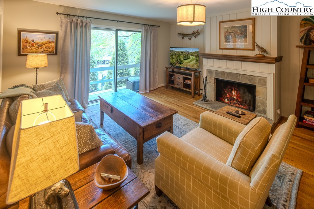 250 Fir, Unit A1 Boone, NC 28607 - Photo 1 of 31 a living room with furniture and a fireplace