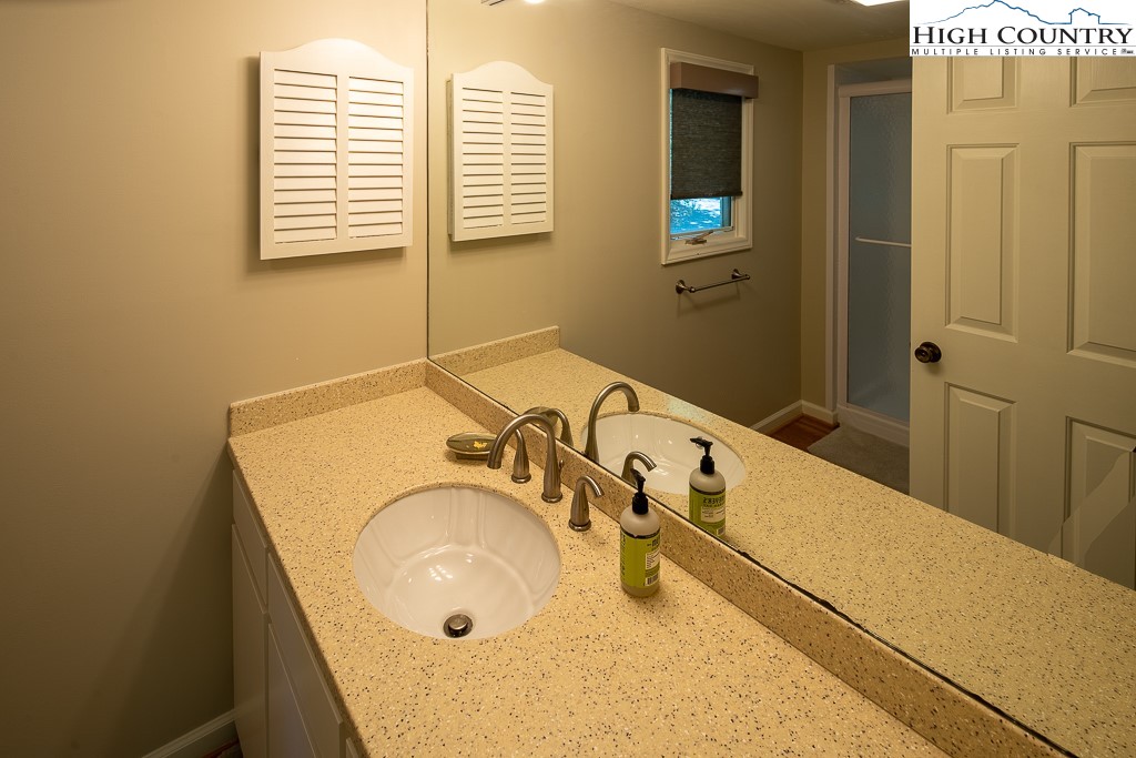 250 Fir, Unit A1 Boone, NC 28607 - Photo 19 of 31 a bathroom with a tub and a sink