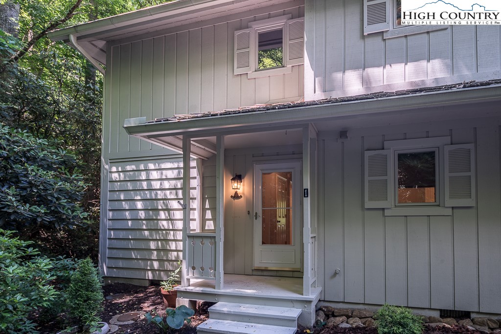 250 Fir, Unit A1 Boone, NC 28607 - Photo 2 of 31 a front view of a house with a yard