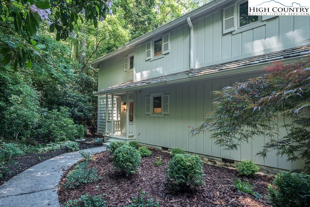 250 Fir, Unit A1 Boone, NC 28607 - Photo 27 of 31 a front view of a house with garden
