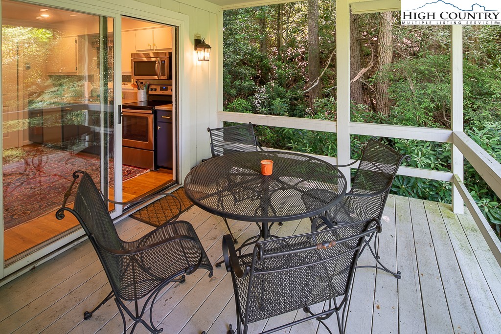 250 Fir, Unit A1 Boone, NC 28607 - Photo 29 of 31 a view of a outdoor seating area with wooden floor