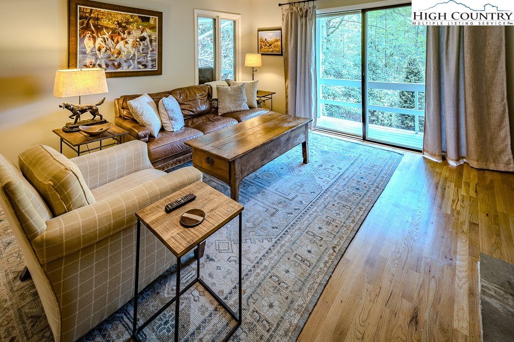 250 Fir, Unit A1 Boone, NC 28607 - Photo 4 of 31 a living room with furniture and a window