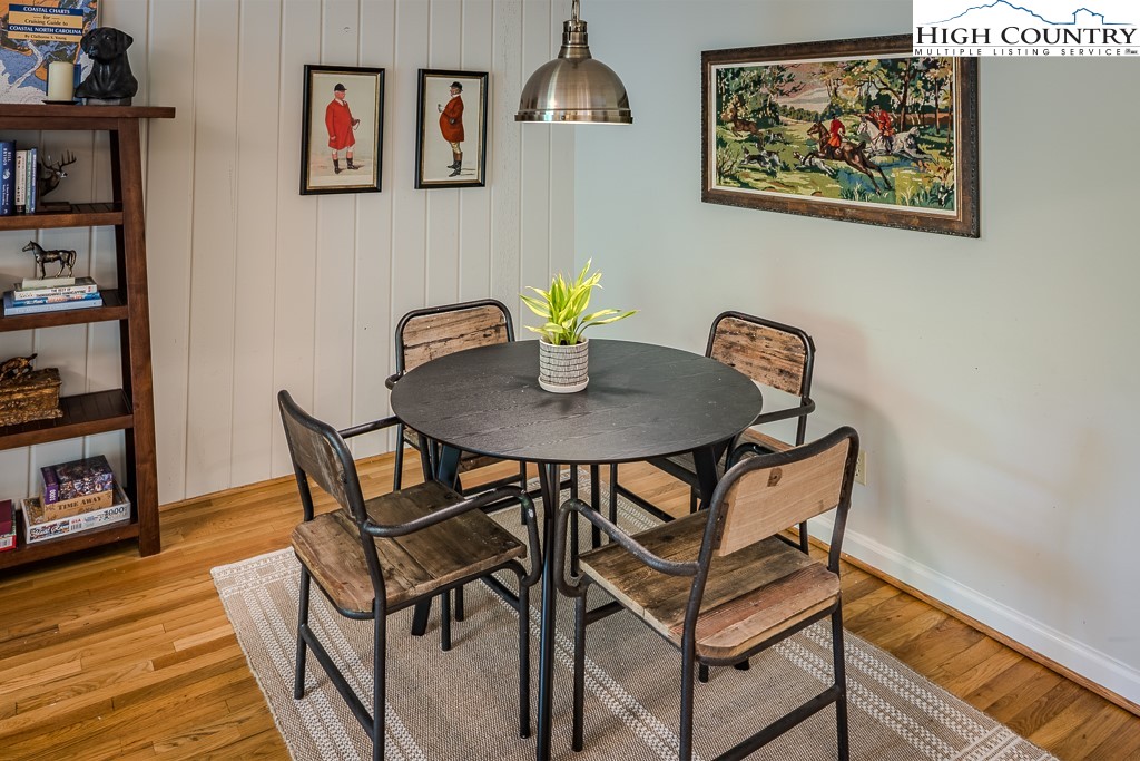 250 Fir, Unit A1 Boone, NC 28607 - Photo 7 of 31 a dining room with furniture and wooden floor