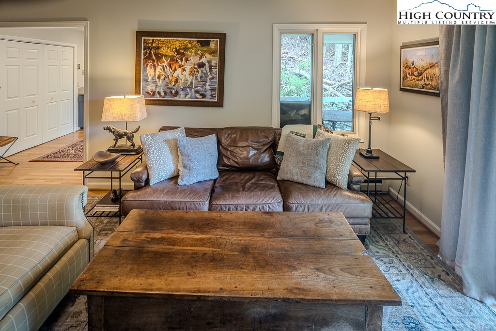 250 Fir, Unit A1 Boone, NC 28607 - Photo 9 of 31 a living room with furniture and a window
