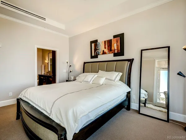 a bed room with a bed and a night stand
