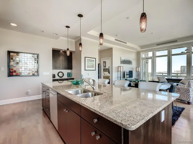 a kitchen with granite countertop living room and living room