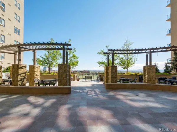 a view of a street with an outdoor seating