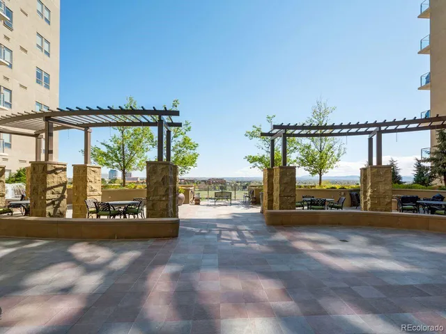 a view of a street with an outdoor seating