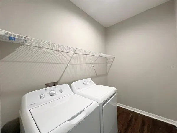 a utility room with dryer and washer