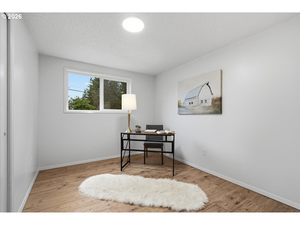 27910 Northeast 28th Street Camas, WA 98607 - Photo 15 of 25 a living room with furniture and a wooden floor