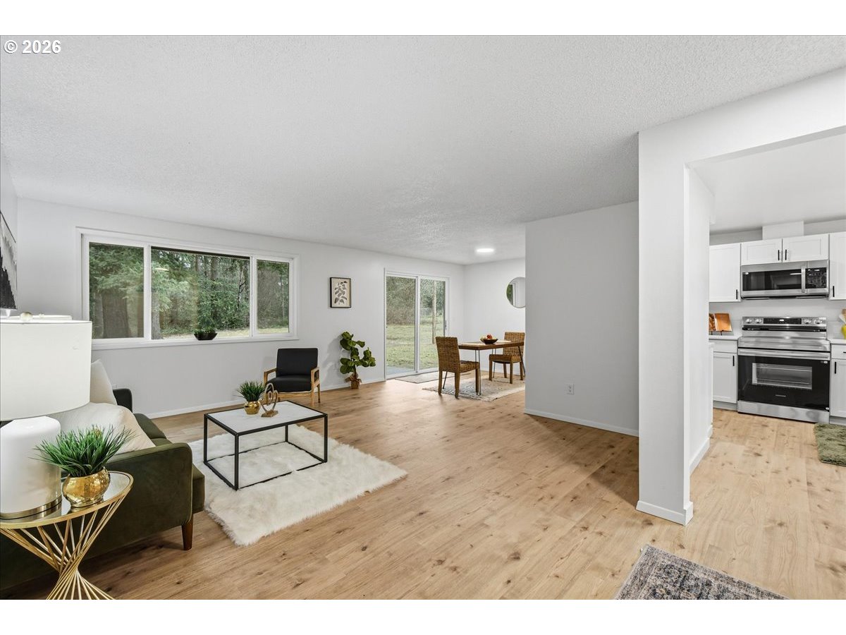 27910 Northeast 28th Street Camas, WA 98607 - Photo 4 of 25 a living room with furniture and a window