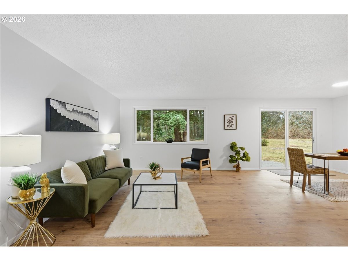 27910 Northeast 28th Street Camas, WA 98607 - Photo 5 of 25 a living room with furniture and a large window