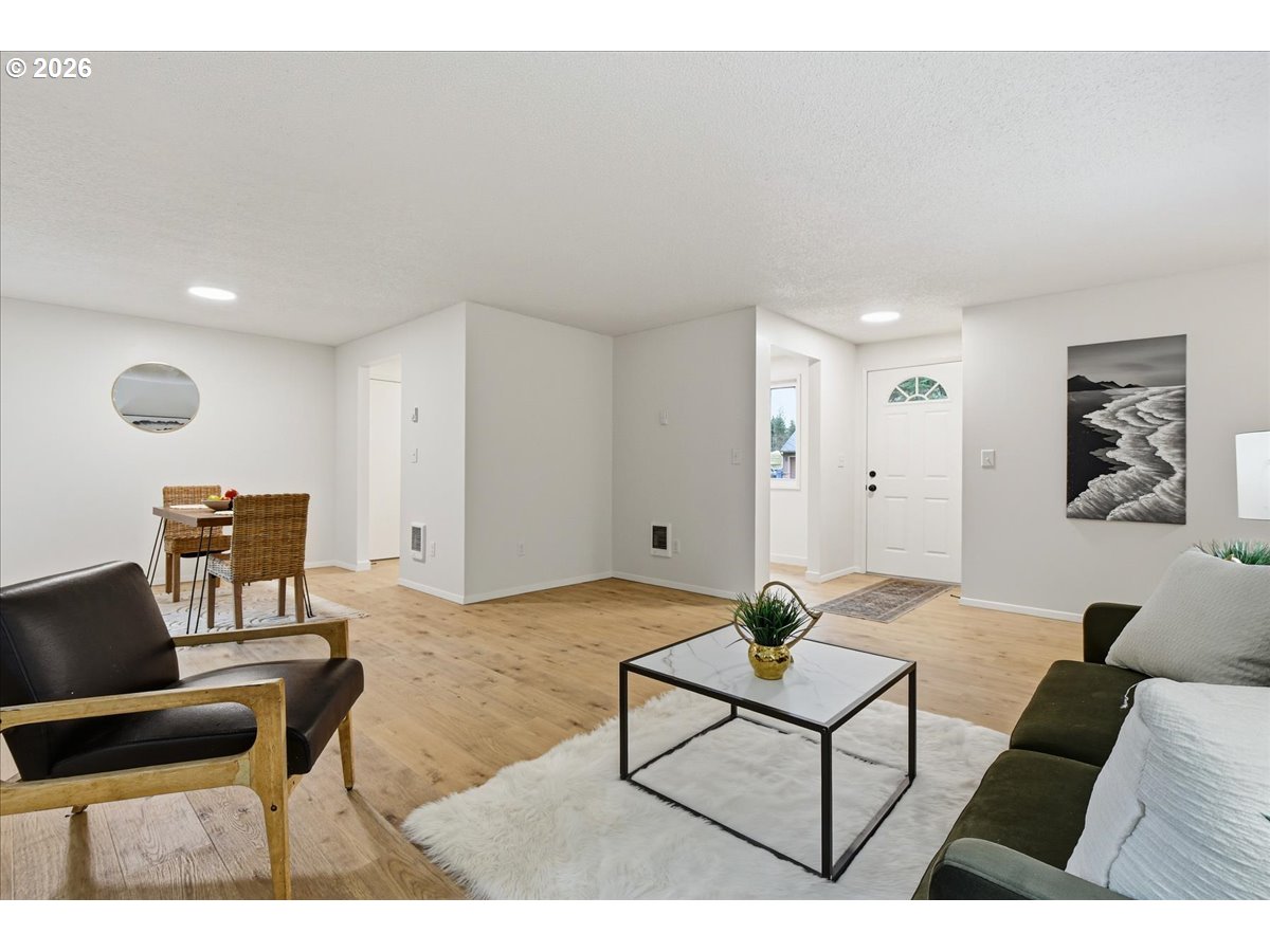 27910 Northeast 28th Street Camas, WA 98607 - Photo 7 of 25 a living room with furniture and a wooden floor