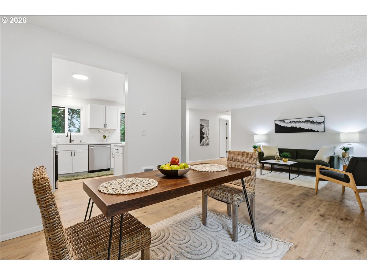 27910 Northeast 28th Street Camas, WA 98607 - Photo 9 of 25 a view of a dining room with furniture and wooden floor