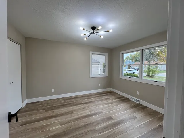 a stove top oven sitting inside of a kitchen