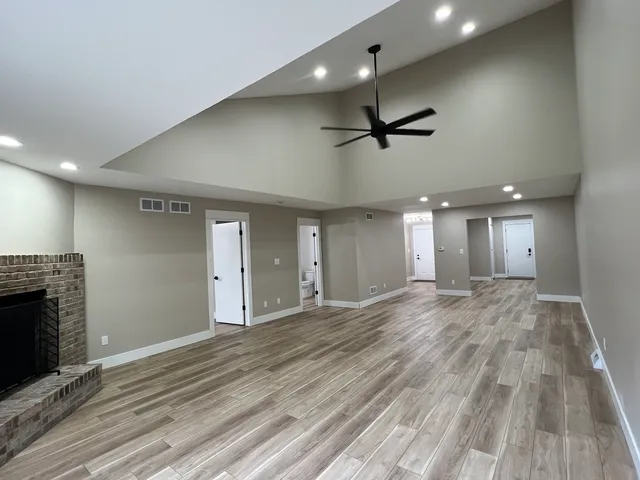 a bathroom with a double vanity sink a mirror and a shower