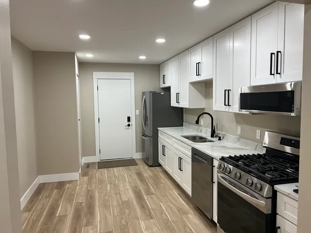 a bathroom with a double vanity sink and a mirror