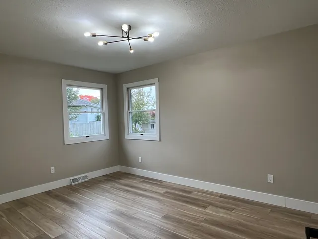 a view of a refrigerator in kitchen and cabinetry