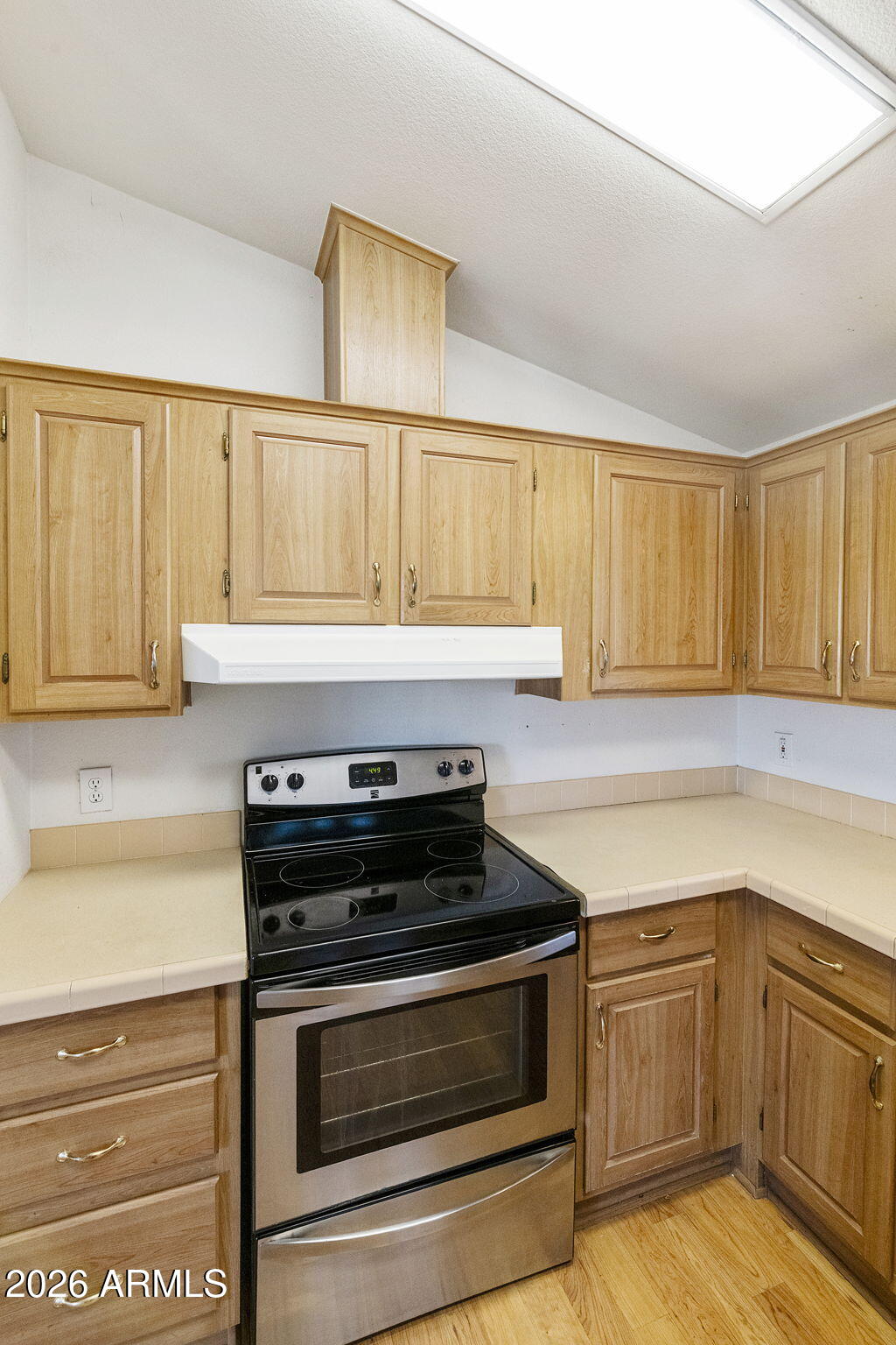 3700 South Tomahawk Road, Unit 73 Apache Junction, AZ 85119 - Photo 10 of 49 a kitchen with a stove and a sink