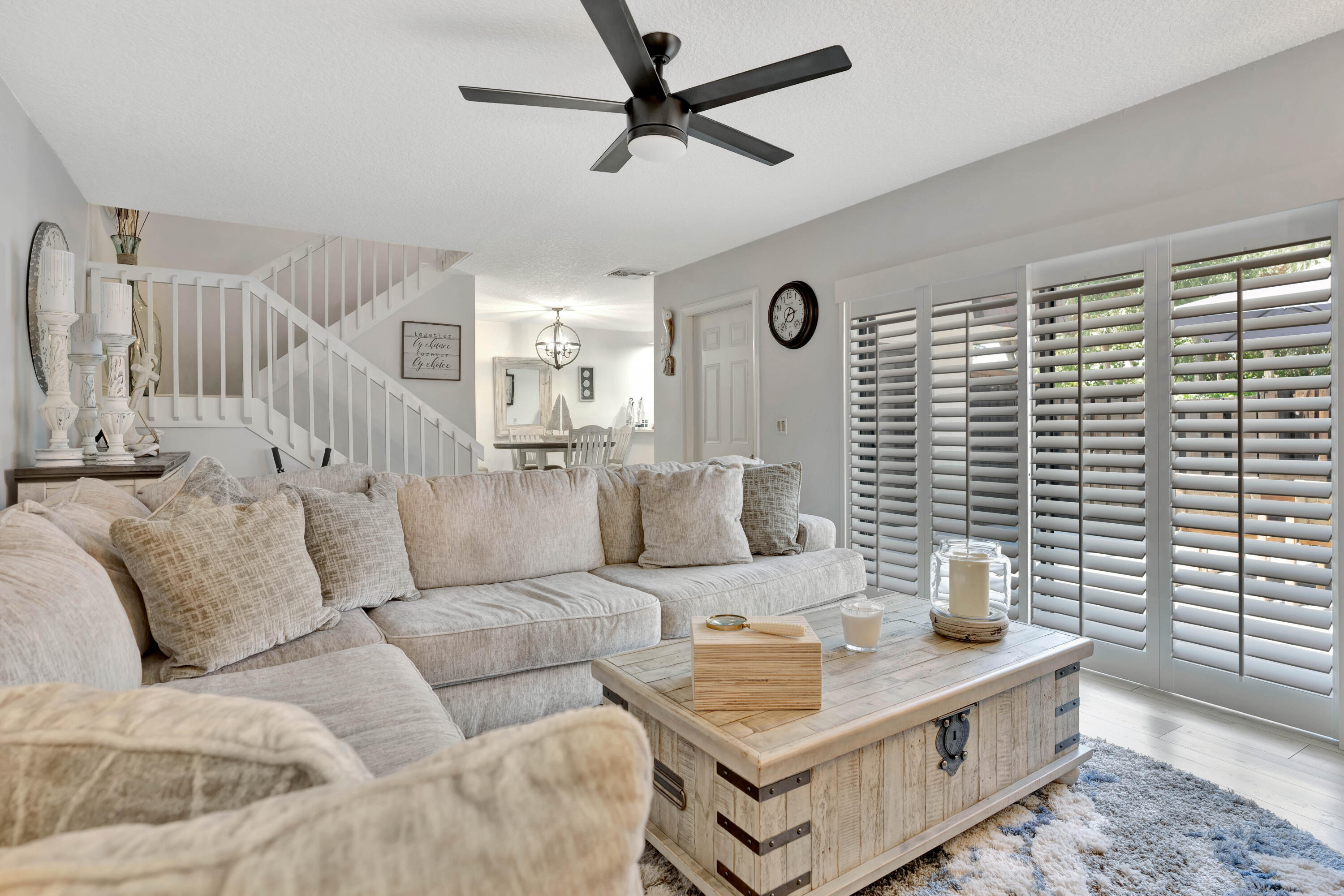 1209 12th Court Jupiter, FL 33477 - Photo 6 of 31 a living room with furniture and a window