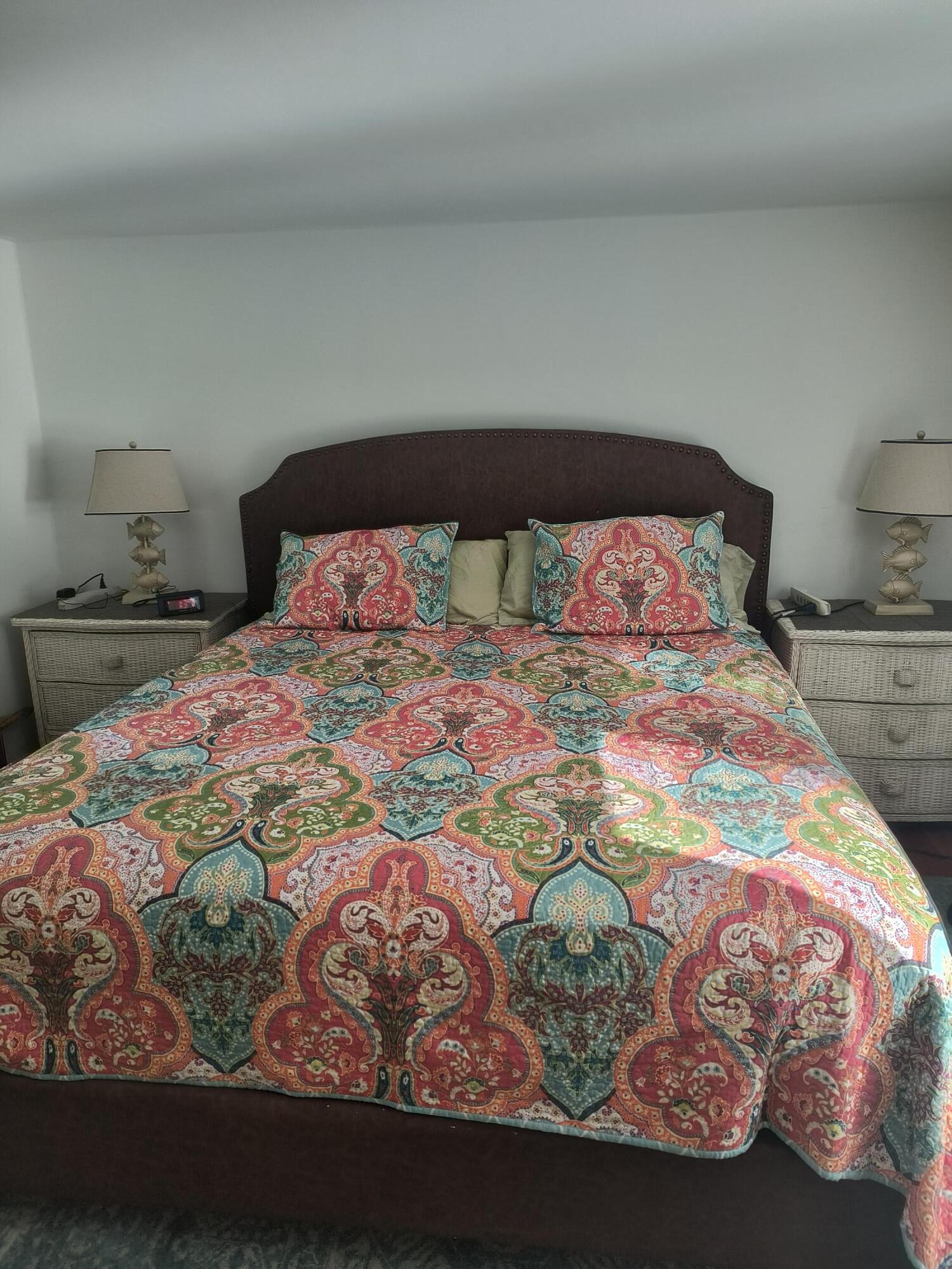 1413 Falmouth Road Centerville, MA 02632 - Photo 21 of 28 a bedroom with a bed and a lamp