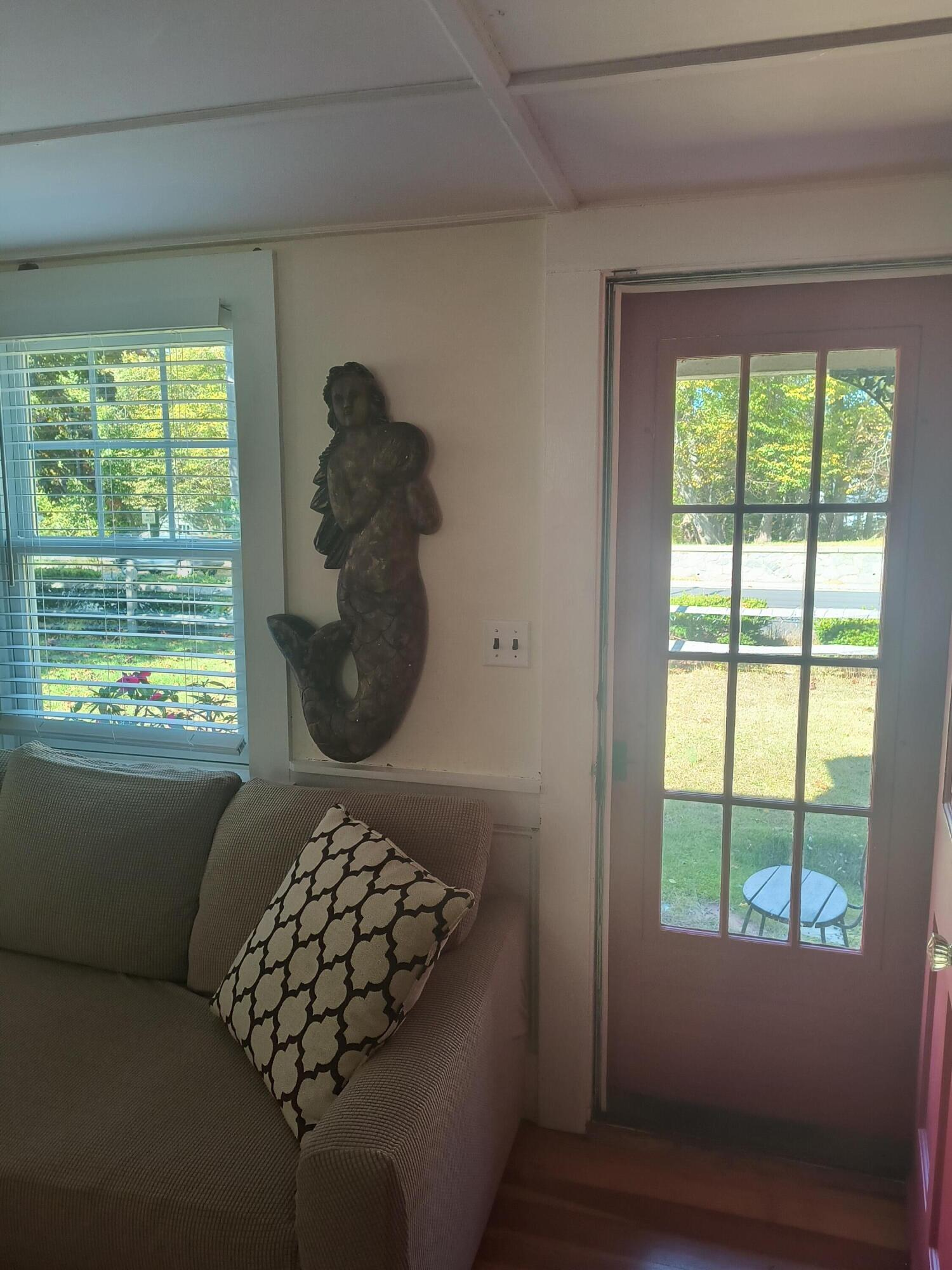 1413 Falmouth Road Centerville, MA 02632 - Photo 28 of 28 a living room with furniture and a large window