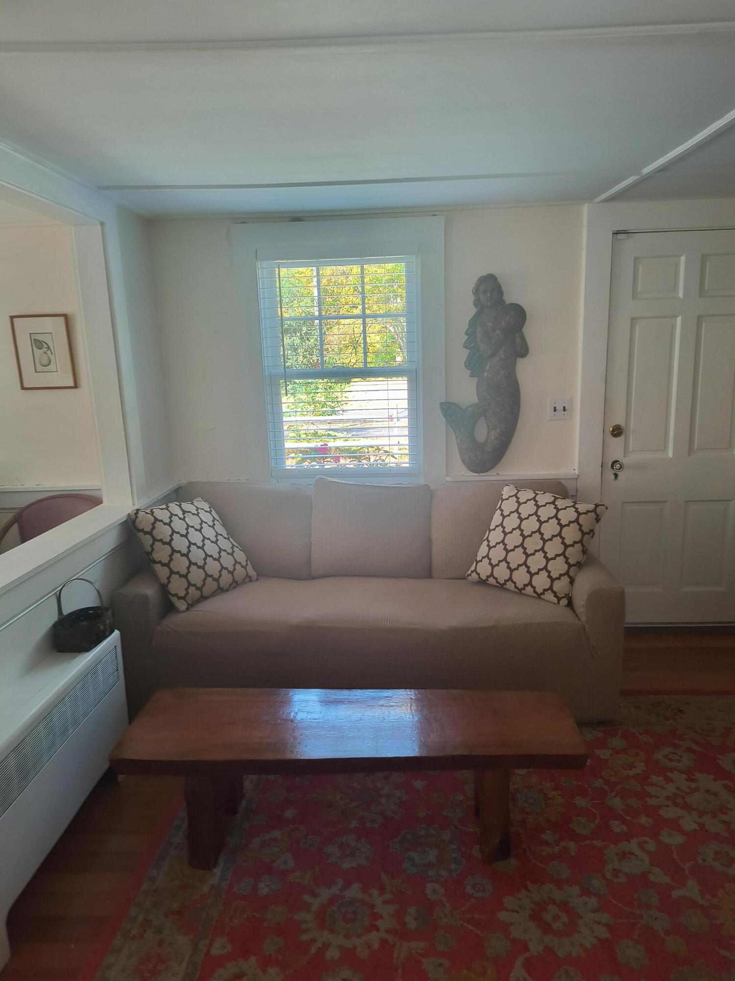 1413 Falmouth Road Centerville, MA 02632 - Photo 5 of 28 a living room with furniture and a window