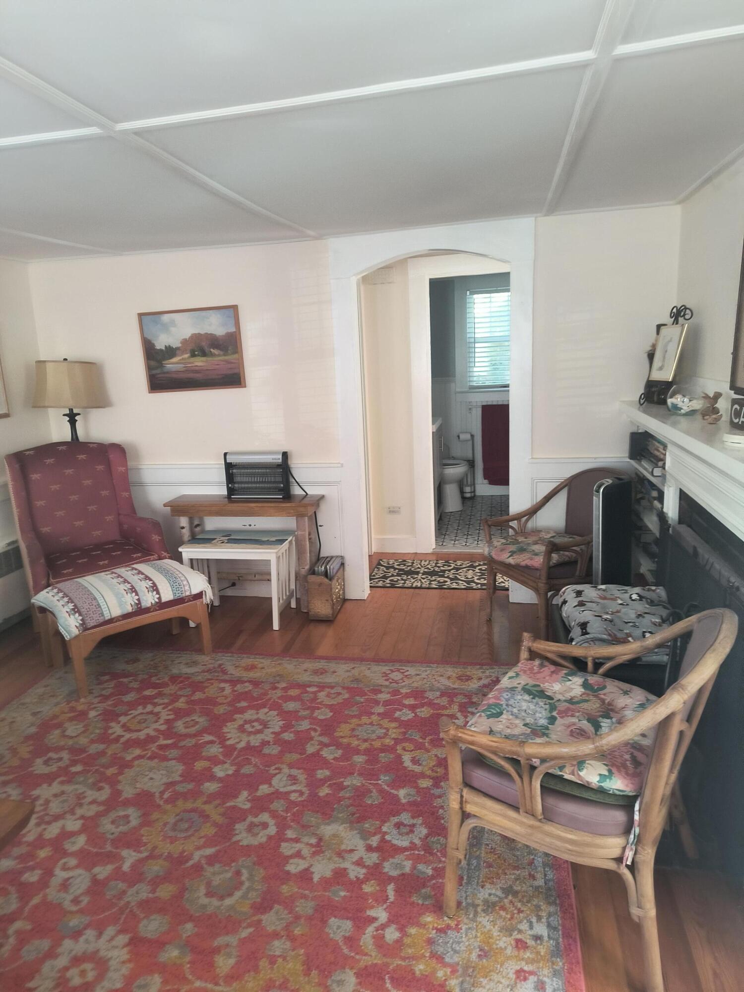 1413 Falmouth Road Centerville, MA 02632 - Photo 7 of 28 a living room with furniture and a wooden floor