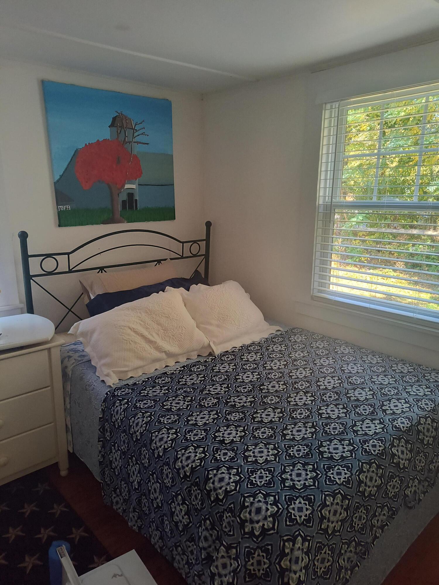 1413 Falmouth Road Centerville, MA 02632 - Photo 10 of 28 a bedroom with a bed and a window