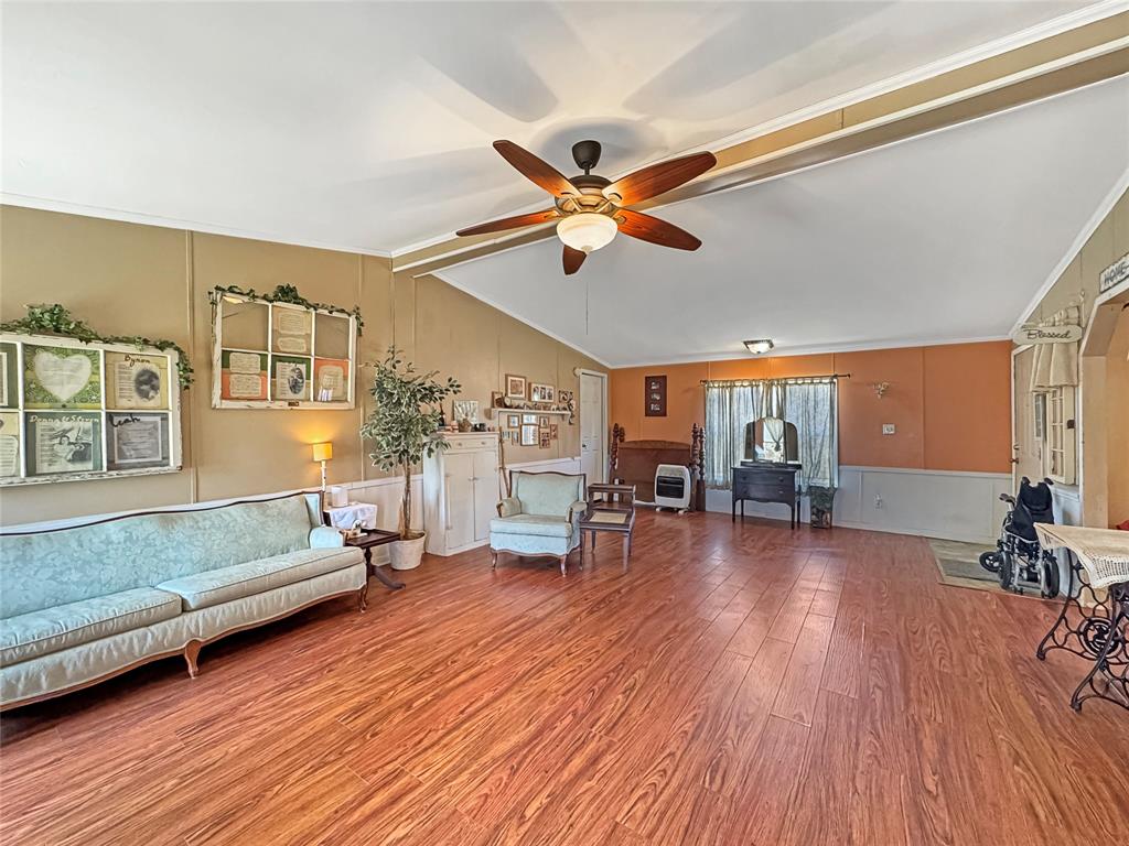 1791 County Road 3855 Poolville, TX 76487 - Photo 12 of 31 a living room with furniture and a wooden floor