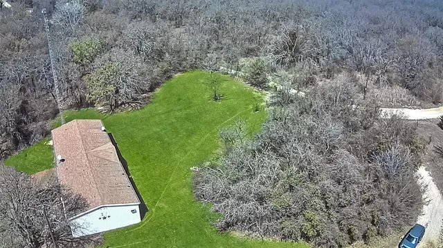 a aerial view of a house with a garden