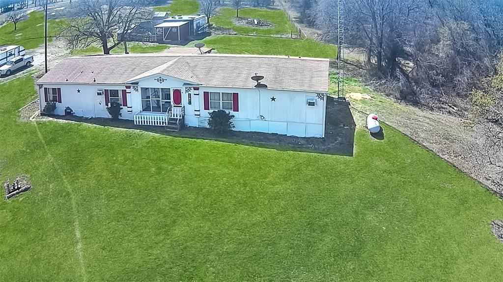 1791 County Road 3855 Poolville, TX 76487 - Photo 31 of 31 a aerial view of a house with a garden