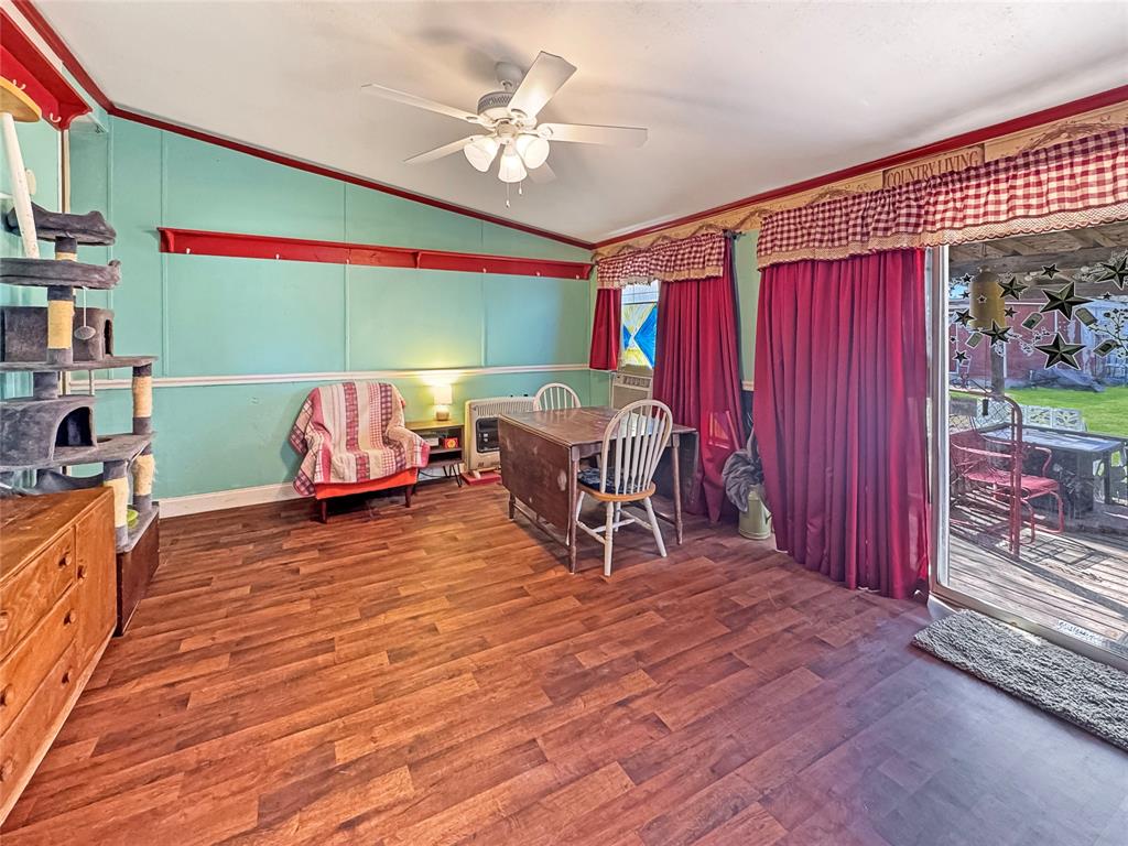 1791 County Road 3855 Poolville, TX 76487 - Photo 7 of 31 a view of a dining room with furniture window and outside view