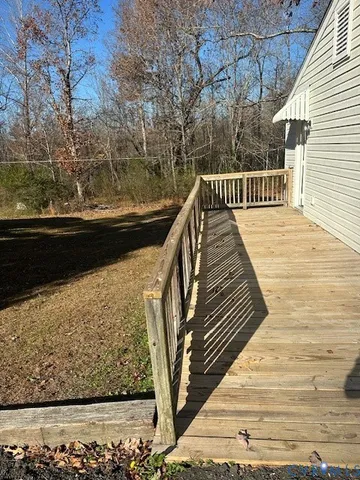 a view of balcony with wooden floor