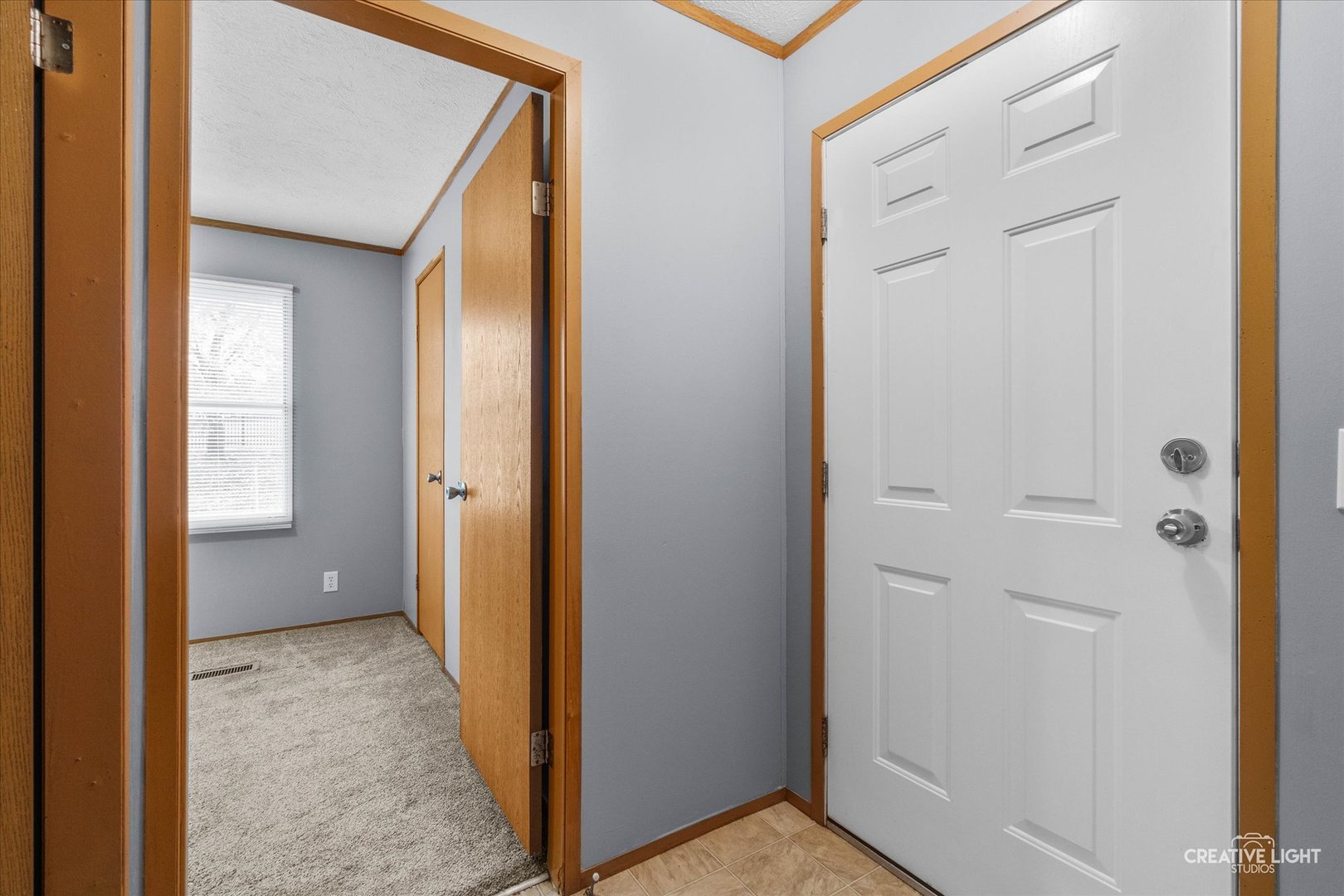 1101 Richard Road Elgin, IL 60123 - Photo 12 of 15 a view of a hallway with a wooden door